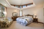 Master bedroom with king bed, TV and adjoining bath